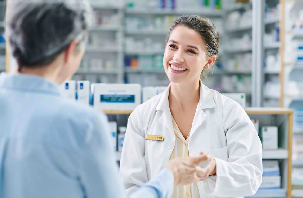 A female pharmacists offering advice to a patient
