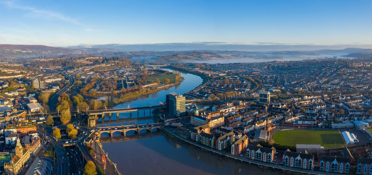 An aerial view at sunrise of Newport city centre, south Wales taken from the River Usk
